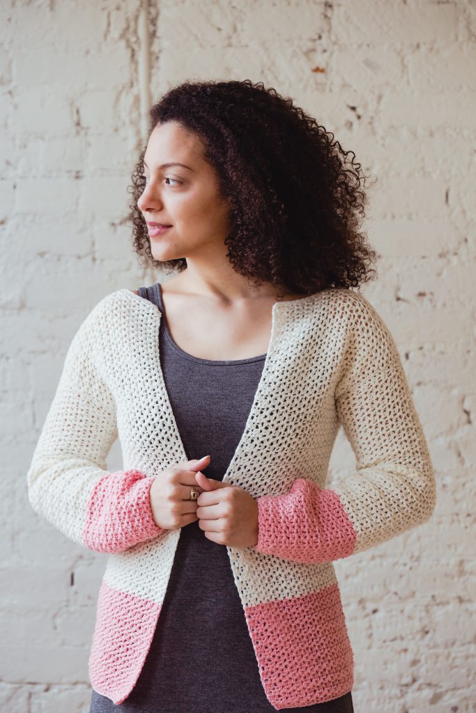Make the easy, beginner friendly Sophia Cardi as the perfect layering piece in spring and summer. Featuring minimal shaping, bold color-blocking, and feminine lace stitching. | New pattern from TL Yarn Crafts