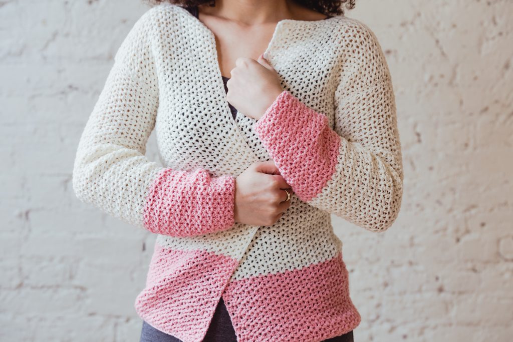 Make the easy, beginner friendly Sophia Cardi as the perfect layering piece in spring and summer. Featuring minimal shaping, bold color-blocking, and feminine lace stitching. | New pattern from TL Yarn Crafts