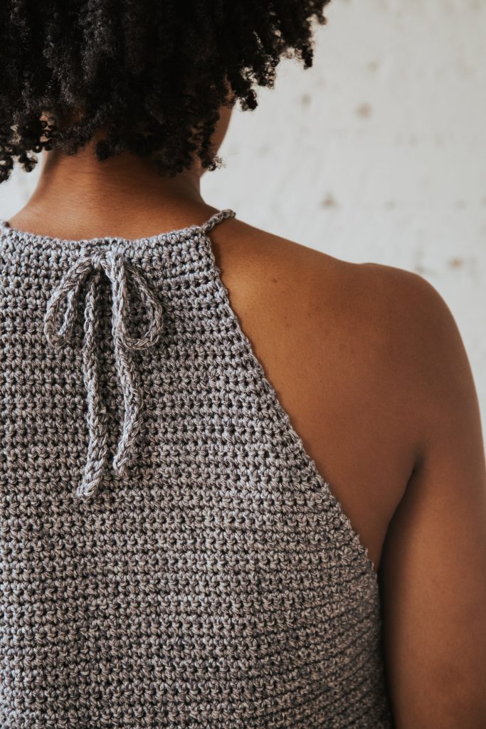 Make the Rebel Cami, a sassy but sweet drawstring halter top crochet pattern from TL Yarn Crafts. Challenge your crochet stills with unique shaping and textured stitches. Pattern available in 2 sizes with plenty of photo tutorials and a helpful chart. Use Lion Brand LB Collection Cotton Jeans for the perfect sleeveless top for summer. 