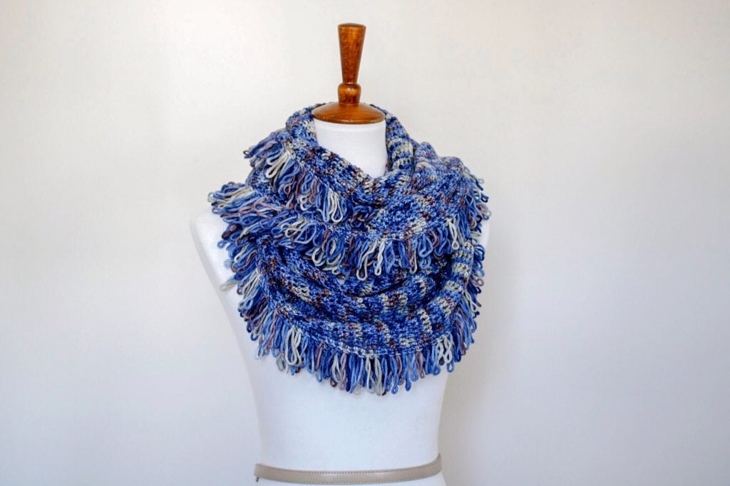 Try the Cara Scarf, a FREE crochet fringe wrap pattern from TL Yarn Crafts. Learn the fun and funky loop stitch and make this beautiful cowl from your favorite worsted weight wool. Find the pattern now on TLYCBlog.com. 