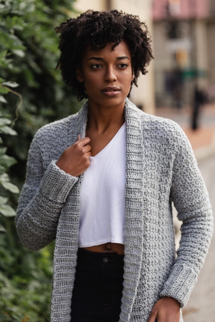 The Sweater Weather Cardi, a FREE pattern from TLYCBlog in collaboration with JOANN Stores, is the first cardigan you'll reach for all winter! Made with comfortable worsted weight yarn in your favorite color, this casual layering sweater is chic, modern, and casual at the same time. Wear it to the office, school dropoff, or those late night Target runs - it's perfect for any ocassion! -- The Sweater Weather Cardi is a FREE crochet pattern featuring step by step instructions and is available in sizes small up to extra large. Start now by visiting TLYCBlog.com! 