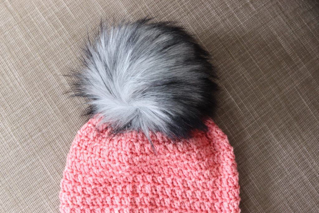 If you're looking for your new go-to crochet slouchy hat pattern, the Mega Pom Beanie is for you! This unisex crochet pattern is unisex and makes a great women's beanie or men's beanie. And the best part is that you can make this textured, gorgeous hat in no time - about 90 minutes! Try it with luxury yarns like those available from Baad Mom Yarns. Visit my blog for more details and to start making your own Mega Pom Beanie! | TLYCBlog.com