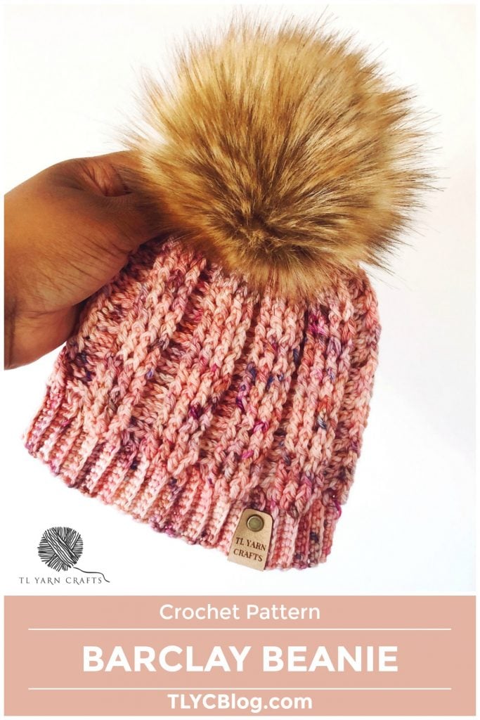 Make the new Barclay Beanie, a fitted ribbed crochet hat with faux fur pom pom and leatherette tag. Find the pattern on LoveCrafts.com and TLYarnCrafts.com. |TLYCBlog.com