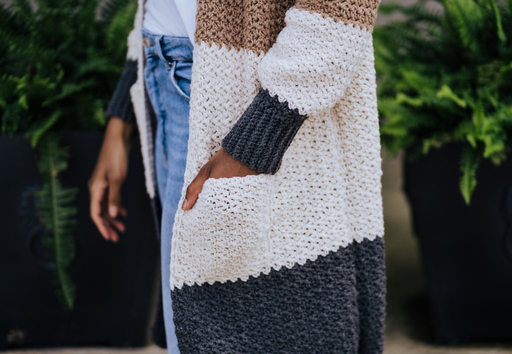 Are you new to crochet garments? Try the Dina Cardi, a beginner level crochet color block sweater with pockets. Customize your colors by building your own project kit with Mary Maxim's Ultra Mellowspun yarn and get the pattern from TLYarnCrafts.com | TLYCBlog.com