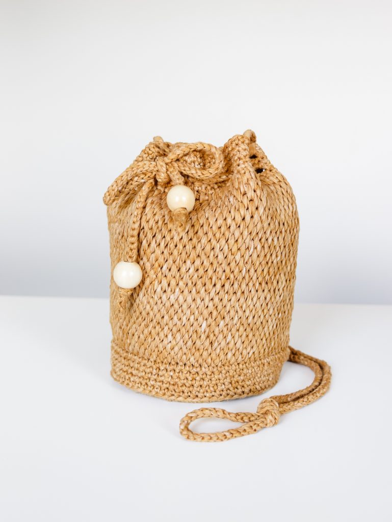 Harper Bucket Bag | Tunisian crochet summer raffia look bag made with Lion Brand Rewind Tape Yarn free crochet pattern with video tutorial and helpful photos. 