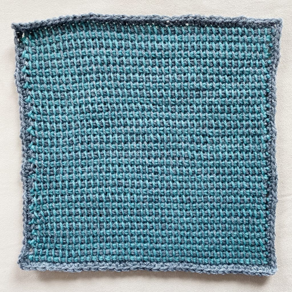 Tunisian crochet two-tone stripes | Free written pattern and tutorial video for Tunisian crochet beginner learn how to crochet the Tunisian crochet arrowhead stitch | TLYCBlog.com