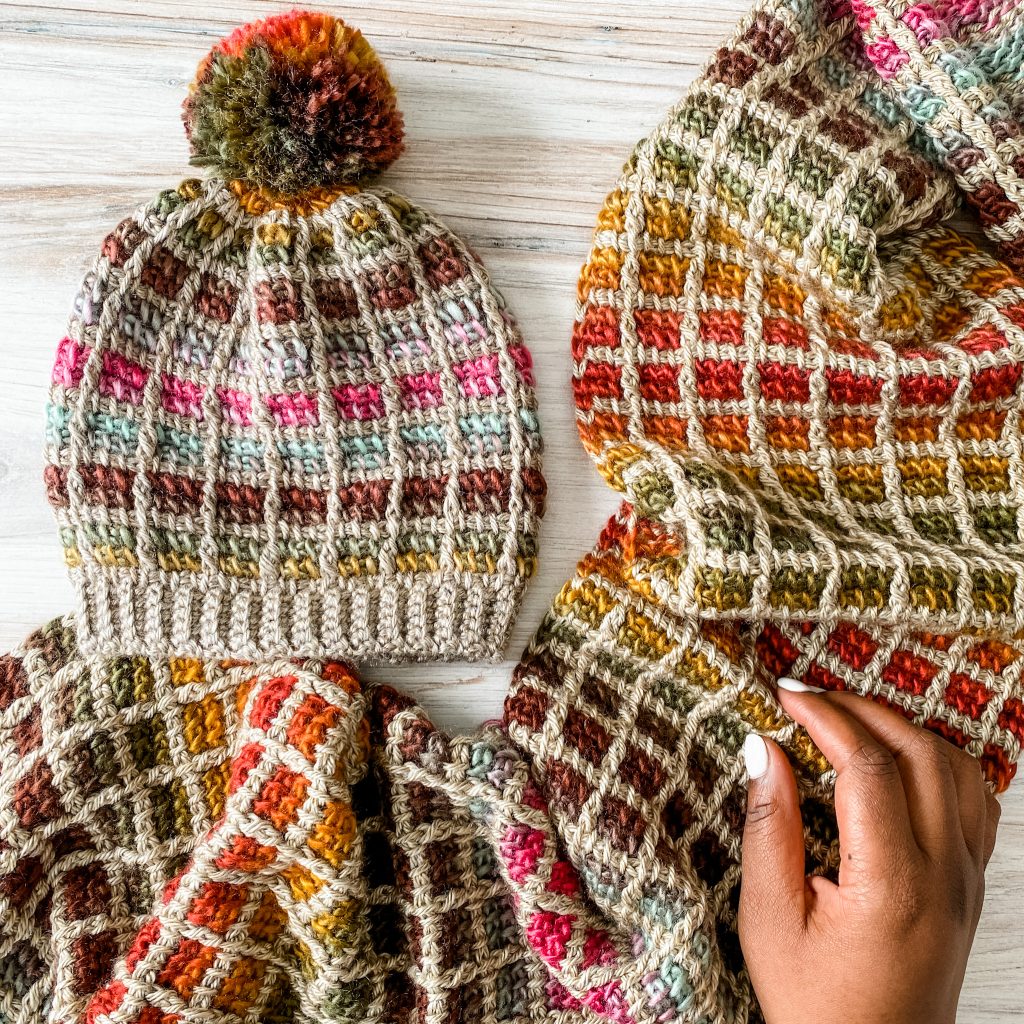 Mesa Hat | Beginner unisex Tunisian crochet hat pattern with tutorial video. Crochet sloughy beanie for women using self striping yarn from Lion Brand. | TLYCBlog.com