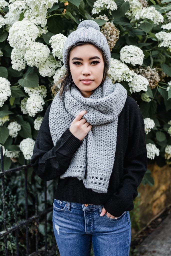 Learn to crochet this easy beginner crochet hat and scarf set with the help of a free pattern. Chic crochet pom pom hat and oversized wrap scarf.