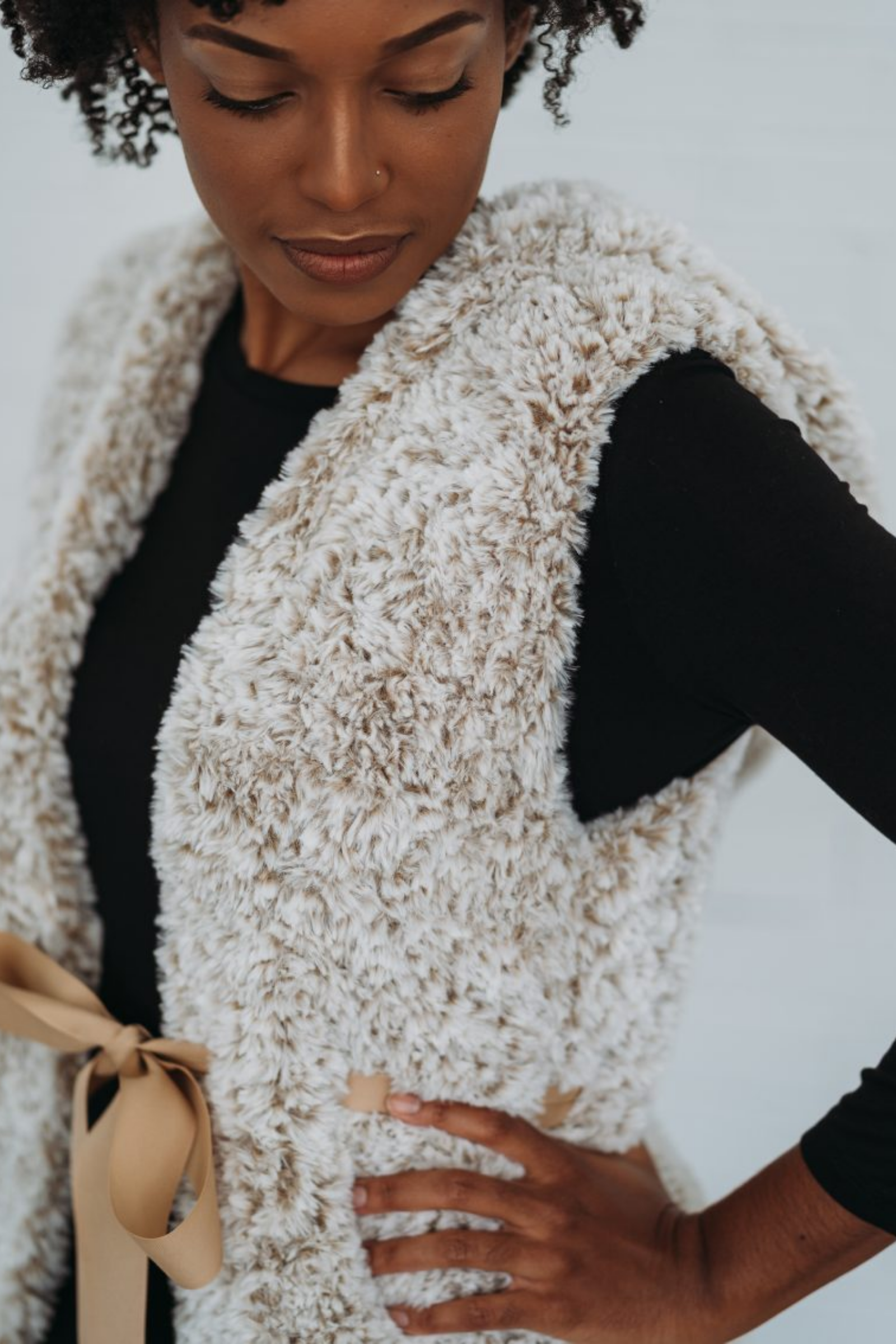 The Mika Vest, a festive hooded faux fur crochet vest pattern - TL Yarn  Crafts