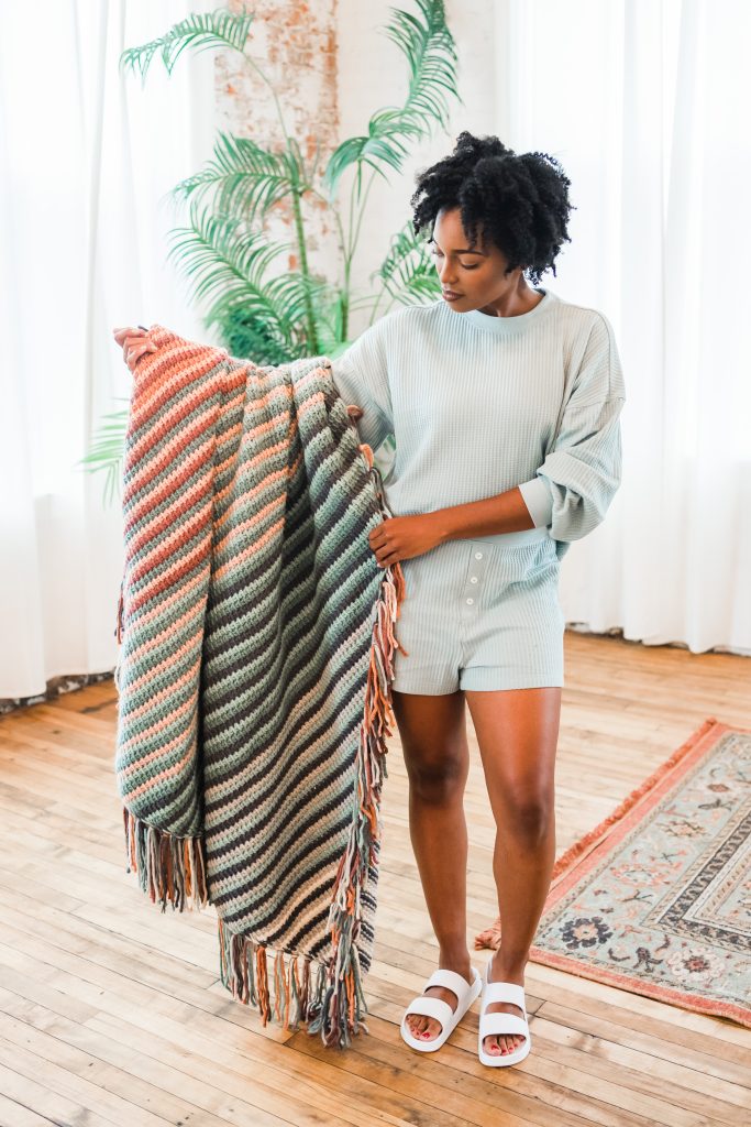 Tunisian crochet blanket pattern, colorful striped throw blanket with fringe, handmade DIY boho couch blanket pattern tutorial | TLYCBlog.com