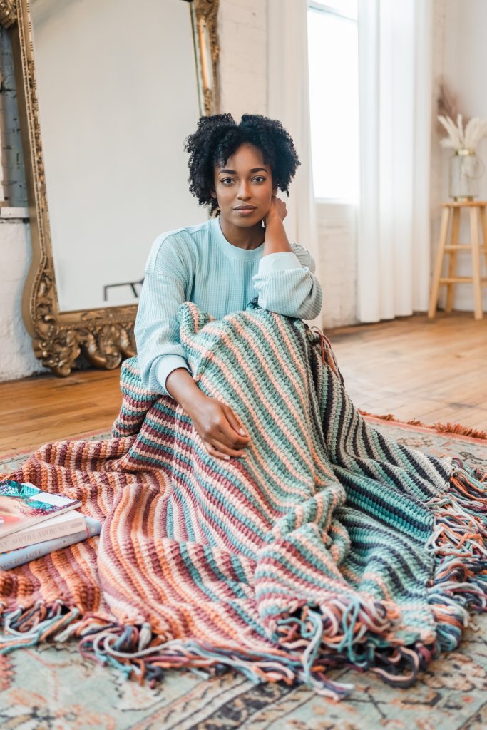 Tunisian crochet blanket pattern, colorful striped throw blanket with fringe, handmade DIY boho couch blanket pattern tutorial | TLYCBlog.com