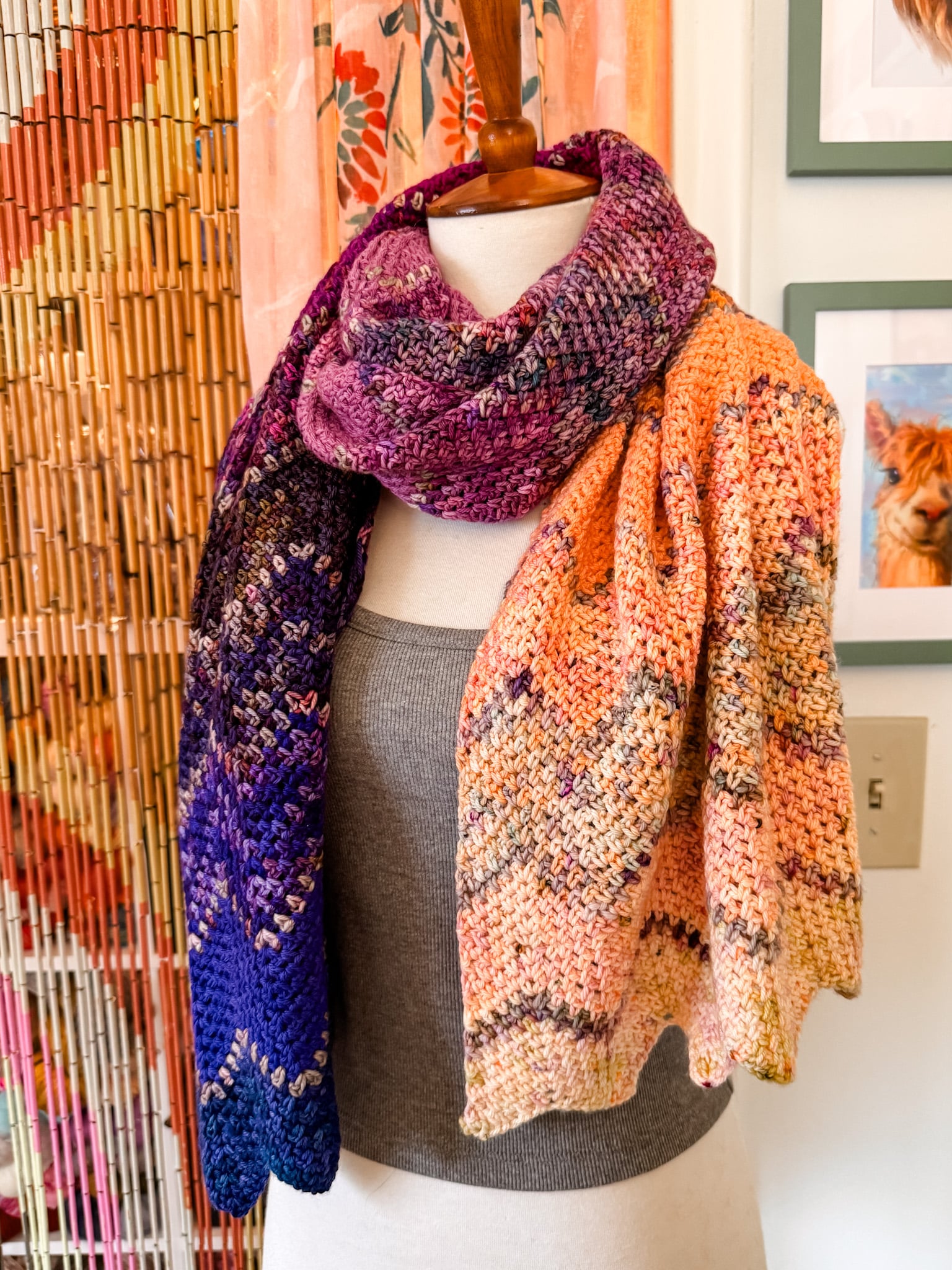 Finished Astral Advent Wrap crochet wrap with a soft drape and chevron texture in a multicolor advent yarn fade