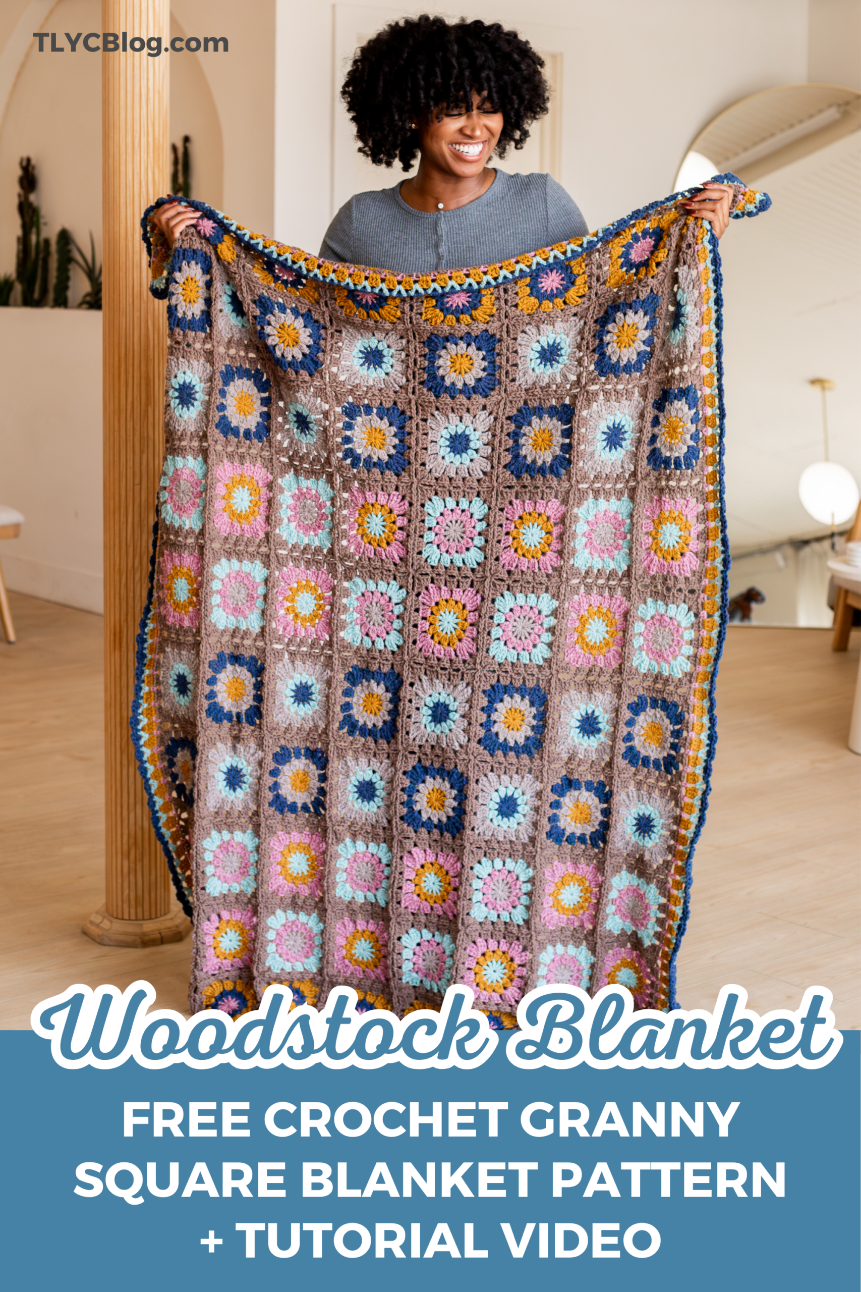 Person holding a large colorful granny square crochet blanket — free crochet pattern and tutorial video by TL Yarn Crafts